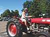 Heather Green on scales as Harold Thomas makes sure there is enough clearance for her to pull on July 18 at the antique tractor pull. Click here!